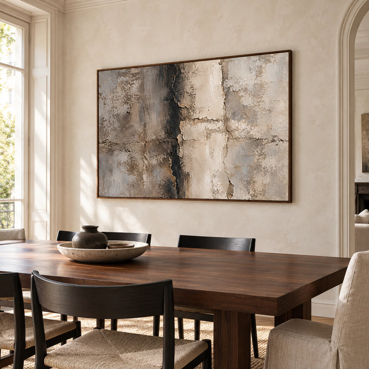 Fracture-Tablet commanding the wall beside a long dining table in a refined, daylight-filled dining room.