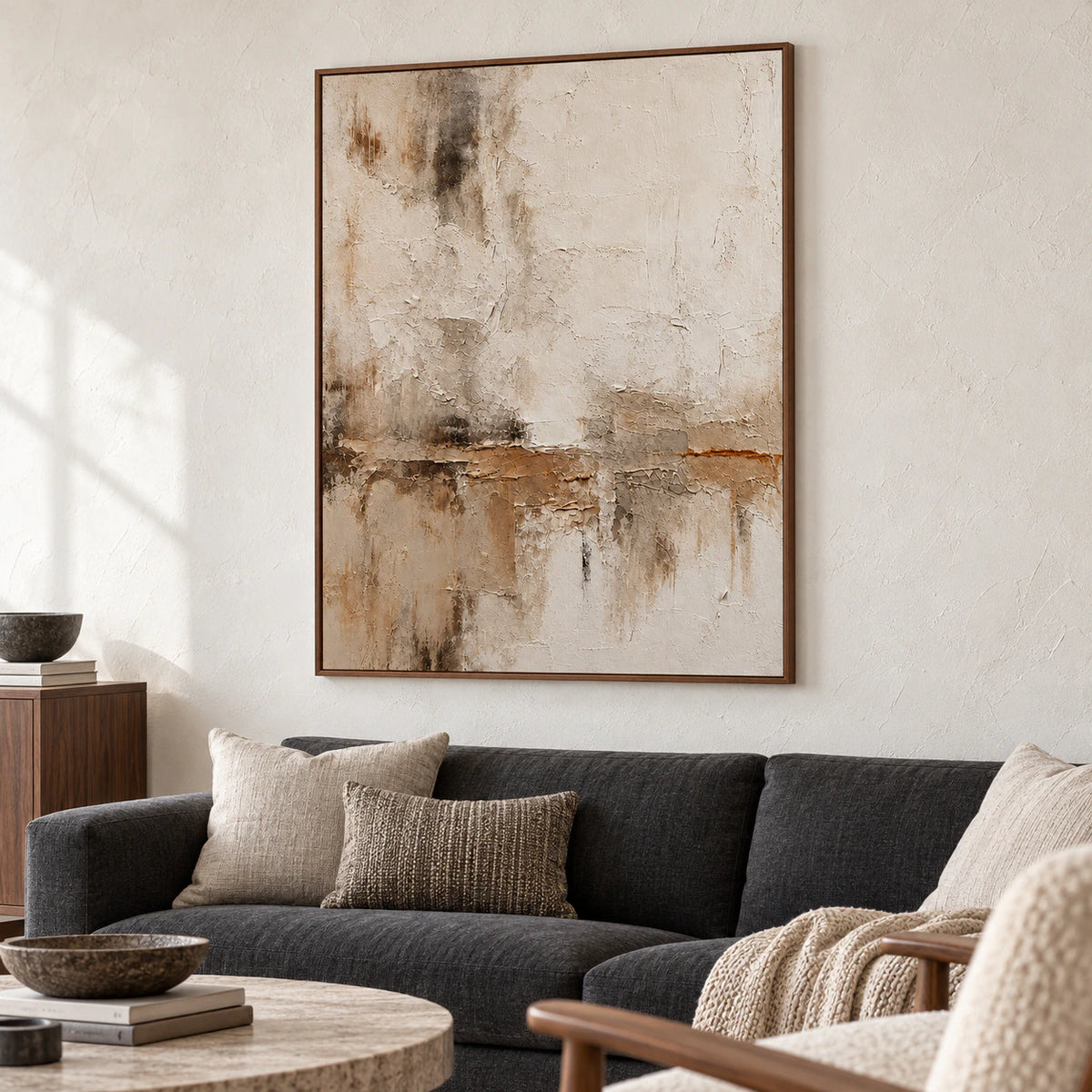 Fractured-Veil artwork above a low charcoal sofa in a bright living room.