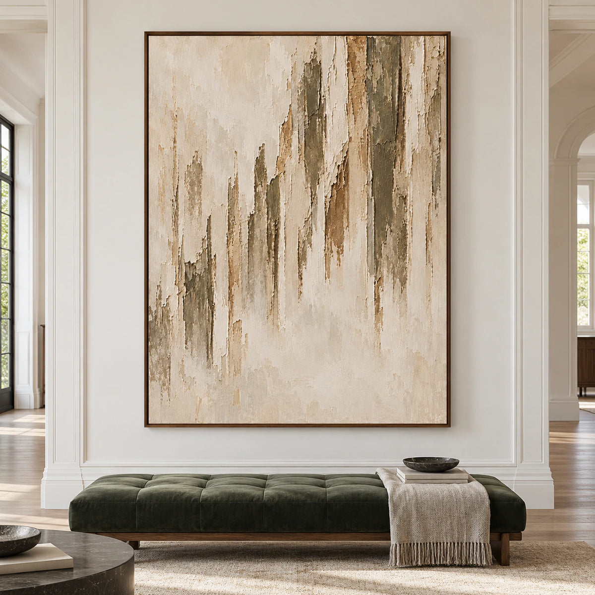 Framed vertical abstract painting with weathered ivory, taupe, and brown bands displayed at large scale in a bright architectural living space.