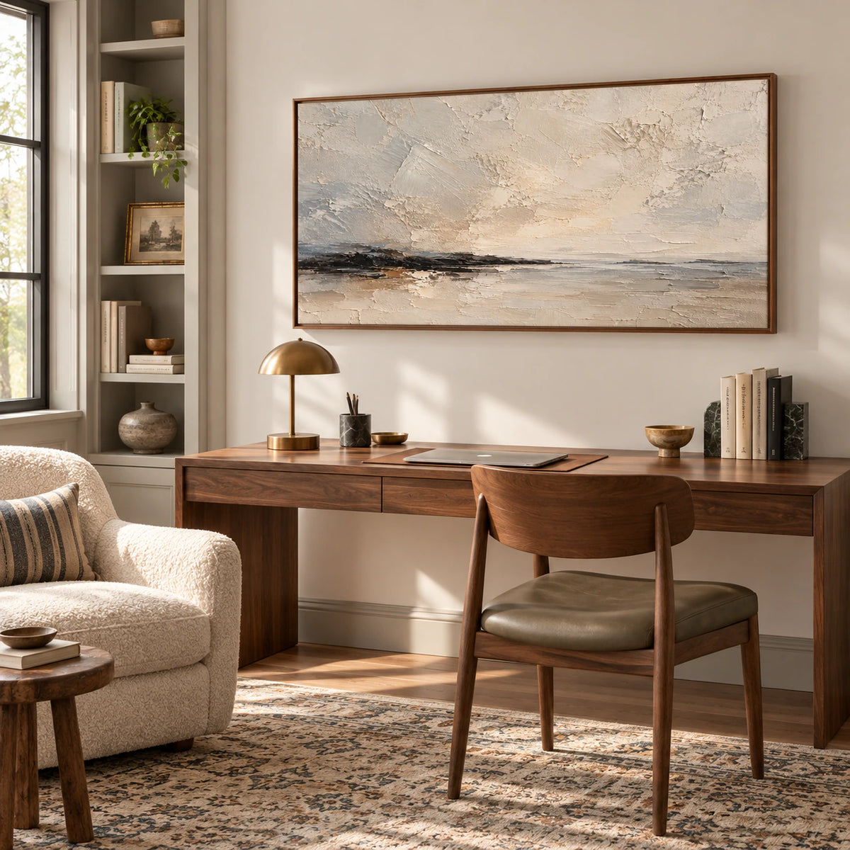 Gesso-Littoral painting above a clean-lined desk in an airy home office, viewed slightly from the left, with a reading chair and open shelving.