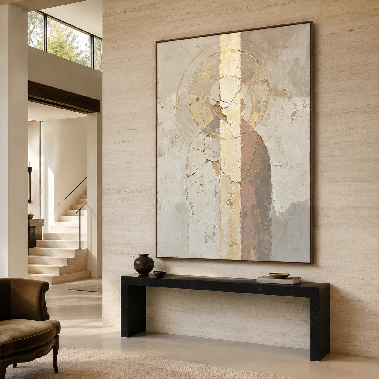 Gallery-scale foyer with a large textured abstract of concentric gold circles.