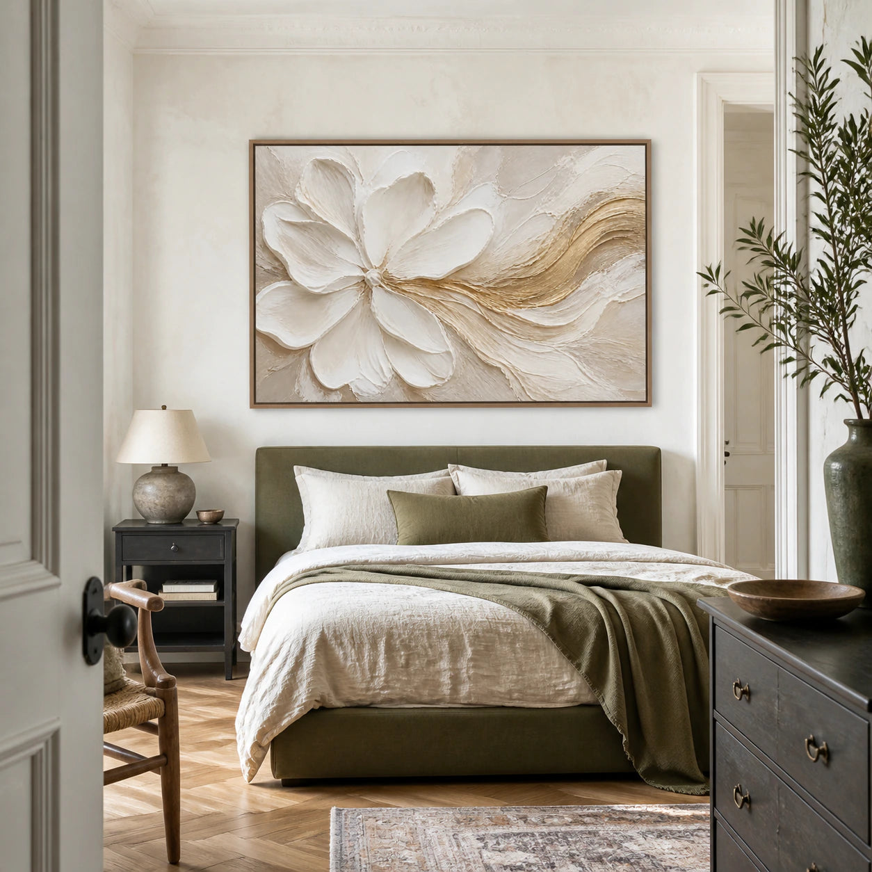 Horizontal ivory floral relief with a warm gold gesture above a calm bedroom bed.