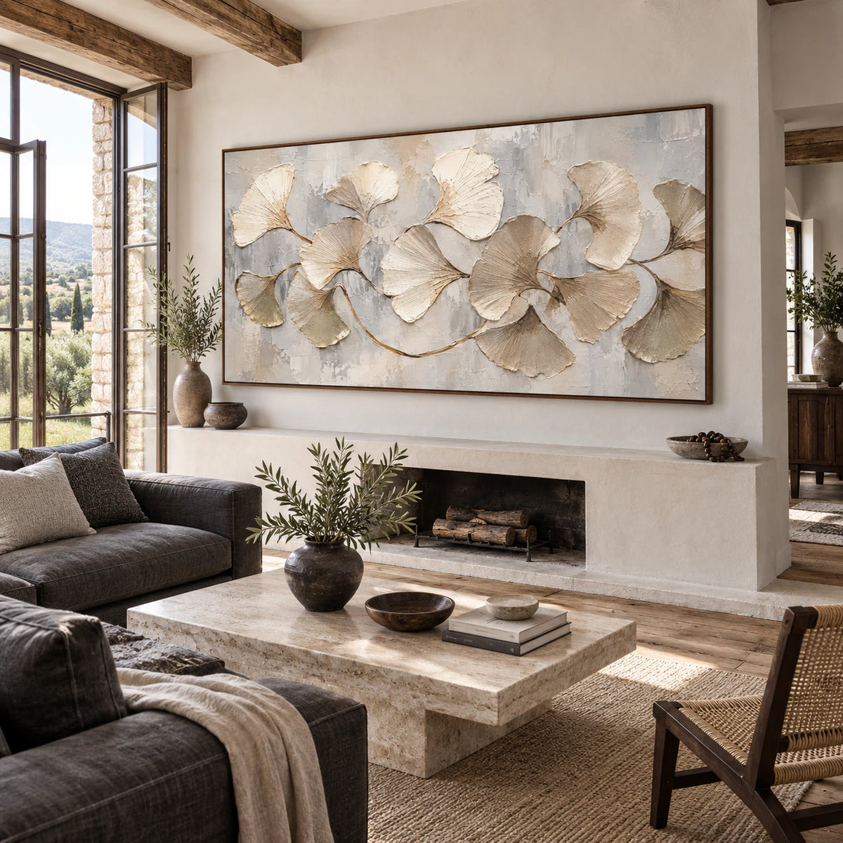 Ginkgo relief artwork above a bright neutral living room seating arrangement.
