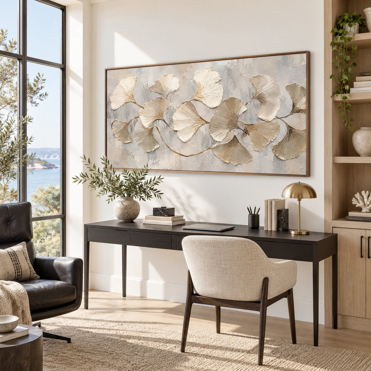 Ginkgo relief wall art in an airy home office reading space.