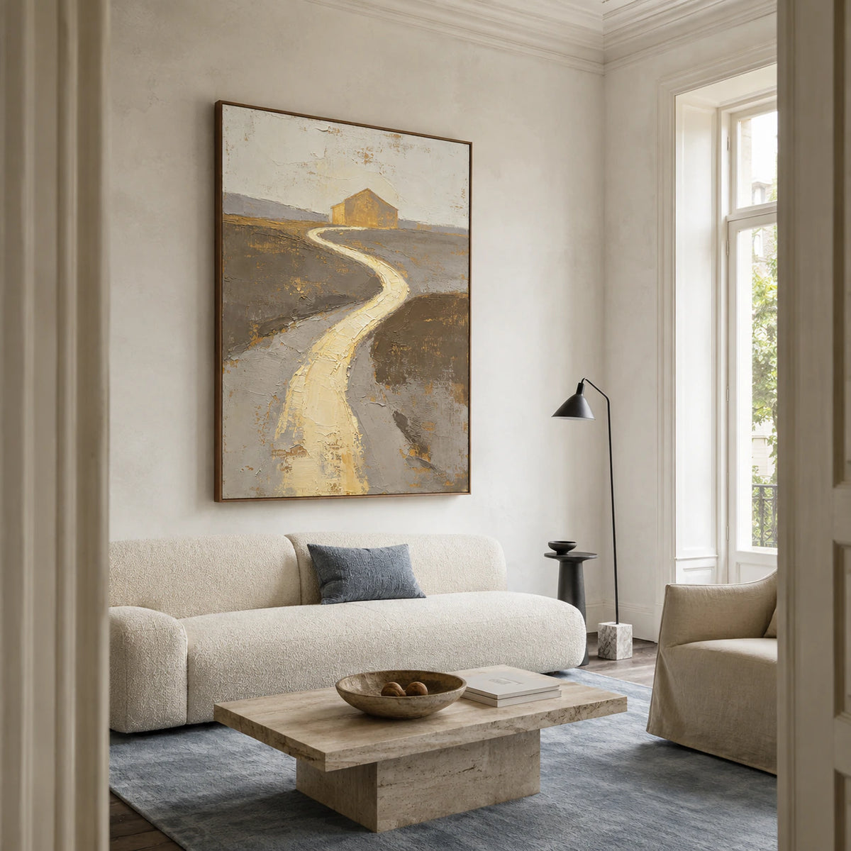 Gilded-Path above a sculptural sofa in a bright contemporary living room.