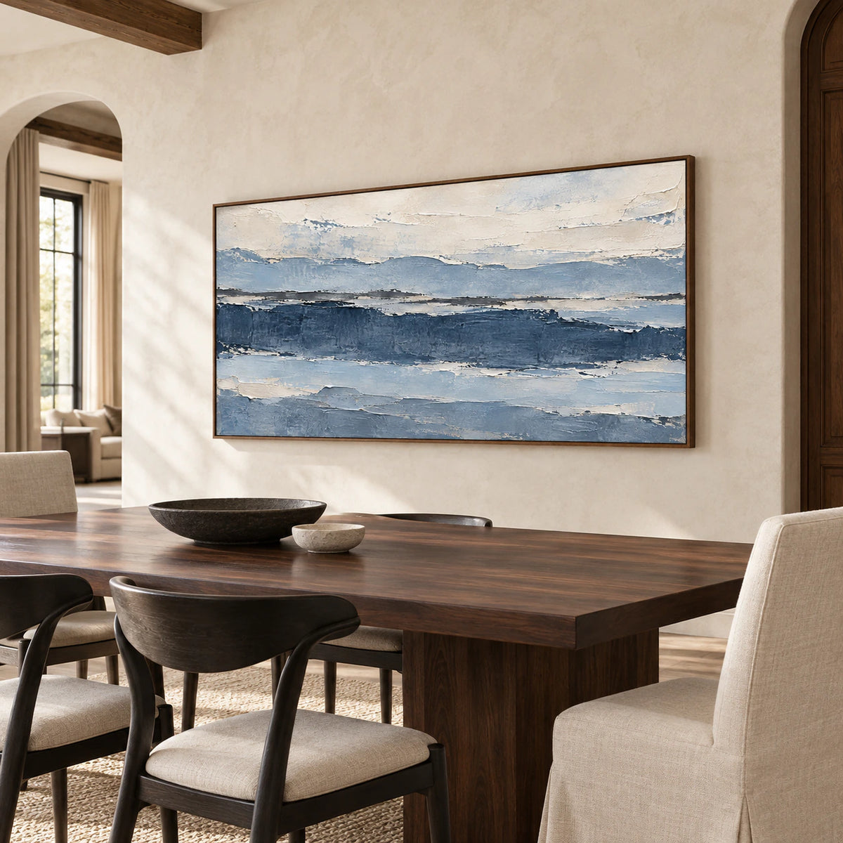 Glacier Ledger above a dark wood dining table in a refined, sunlit dining room.