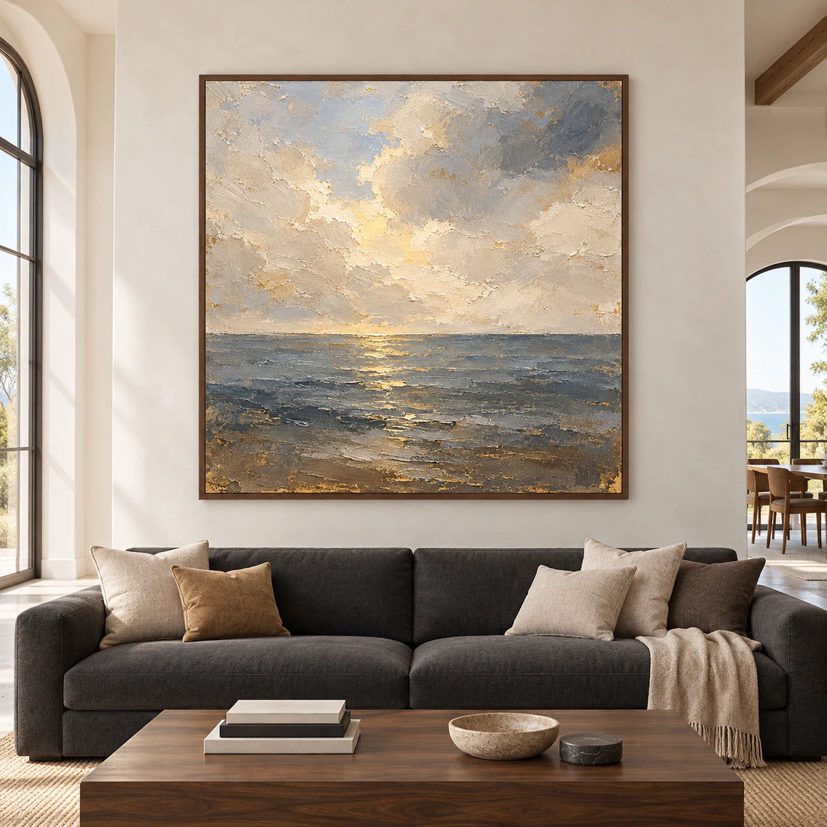 Straight-on view of Gloaming-Tide on a pale plaster wall above a low charcoal sofa in a spacious, bright living room.