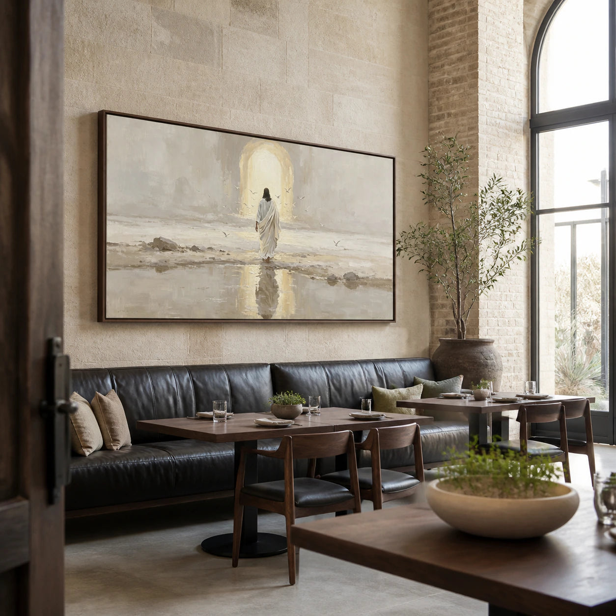 Large robed-figure shore painting in an expansive sunlit hospitality loft.