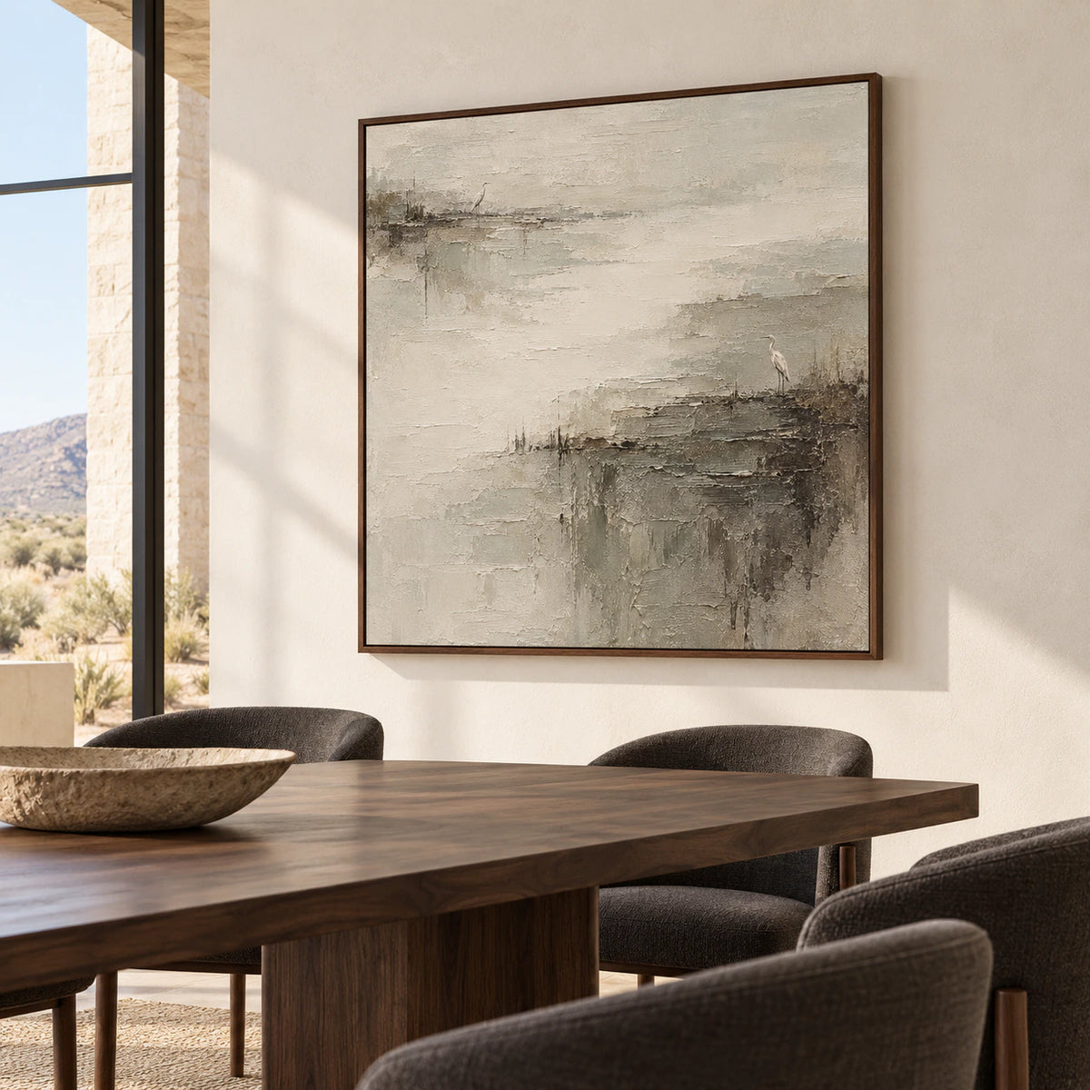 Large square heron marsh painting as the focal point of a refined dining room with a dark wood table, light walls and tall windows.
