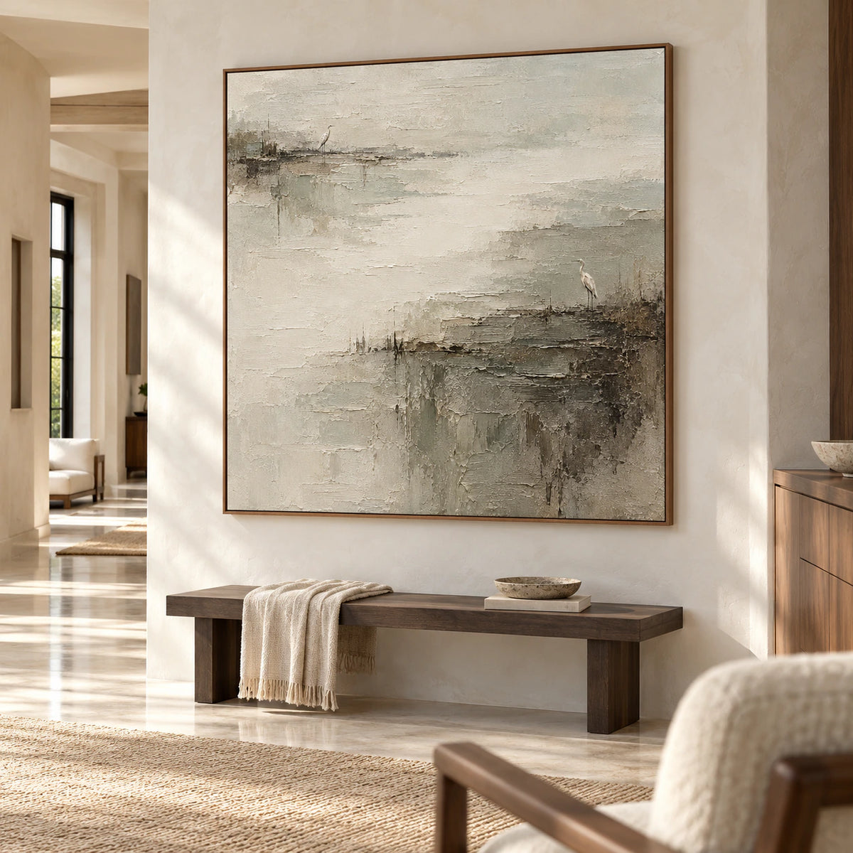 Large square heron marsh painting commanding a gallery-scale foyer with a stone floor, pale plaster walls and natural light.