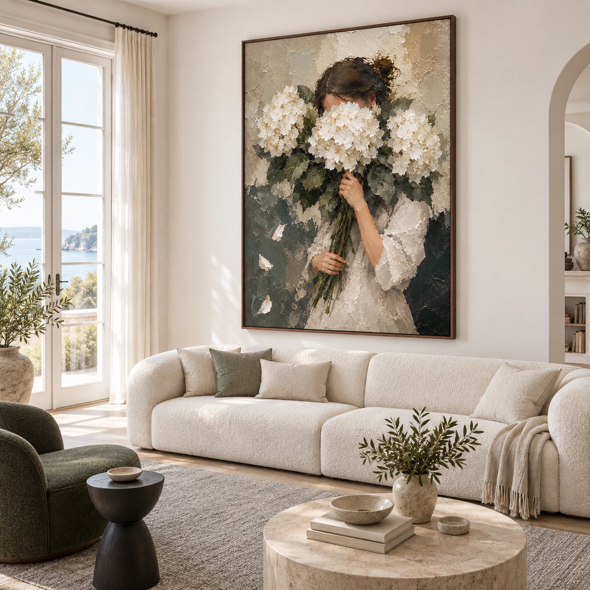 Hushed-Hydrangeas displayed prominently above a restrained sofa in a bright living room.