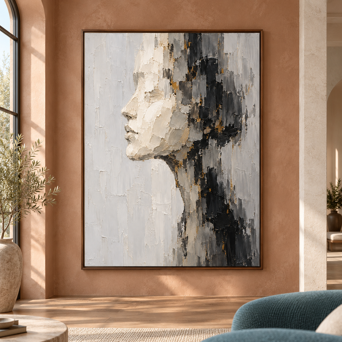 Large vertical painting of a left-facing ivory profile shown straight on in a spacious architectural room with neutral furnishings and bright natural daylight.