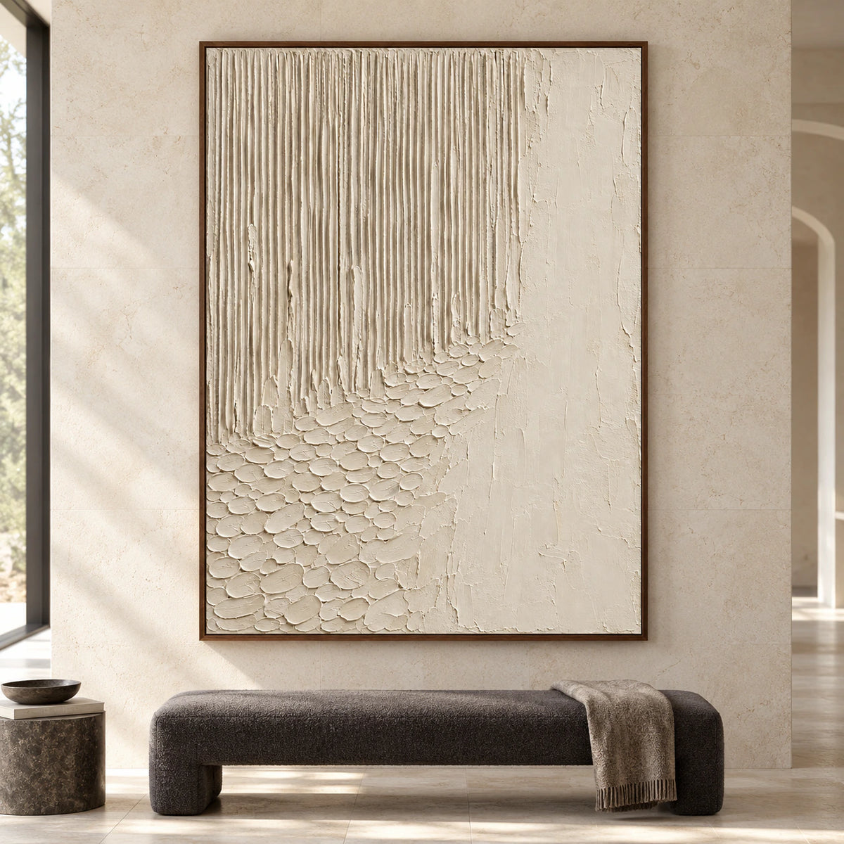 Ivory-Cascade oil painting on a pale limestone wall above a low charcoal bench in a spacious, daylit room, viewed straight-on.