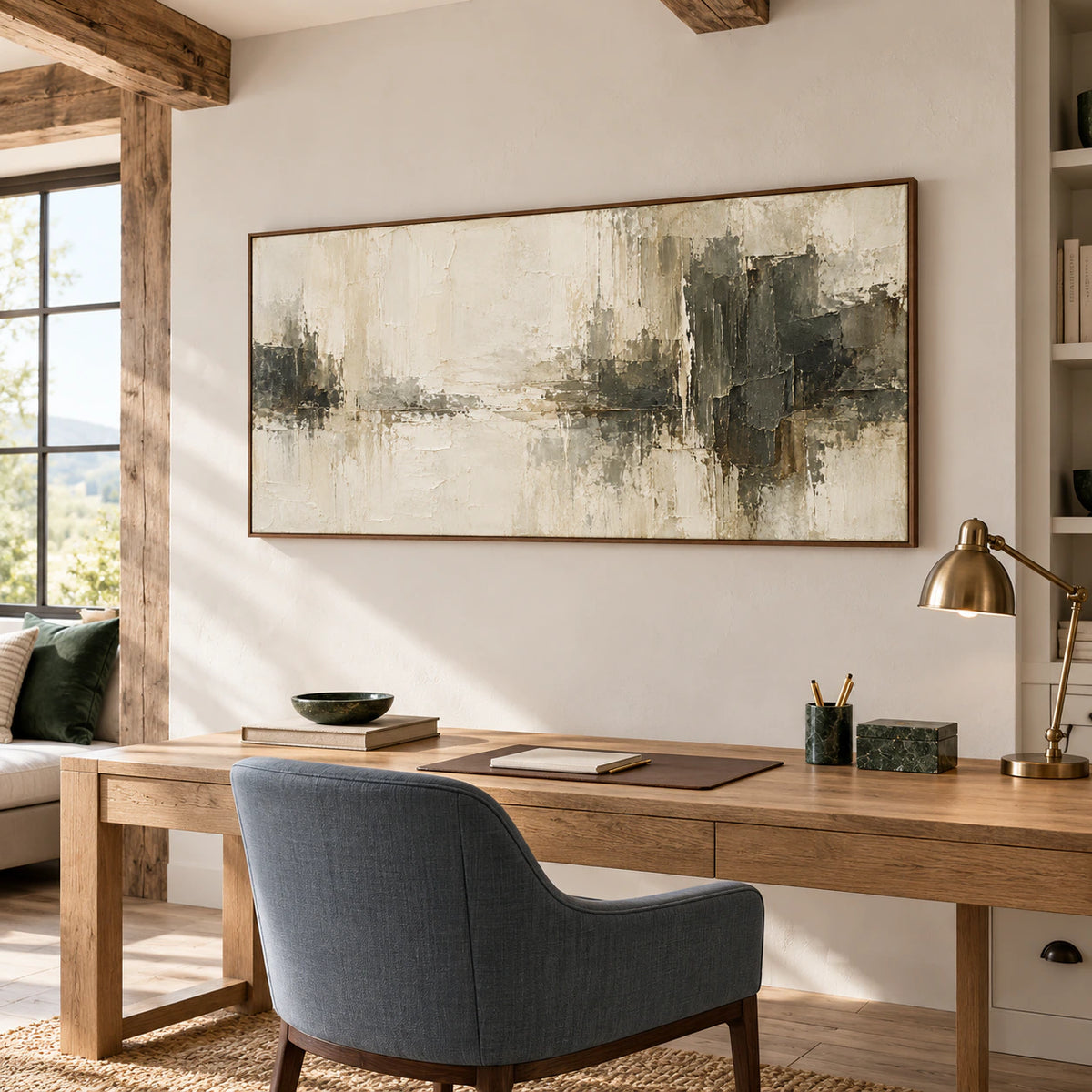 Ivory-Divide in a bright home office with an oak writing desk, blue-gray desk chair and dark green accents, viewed from the right.