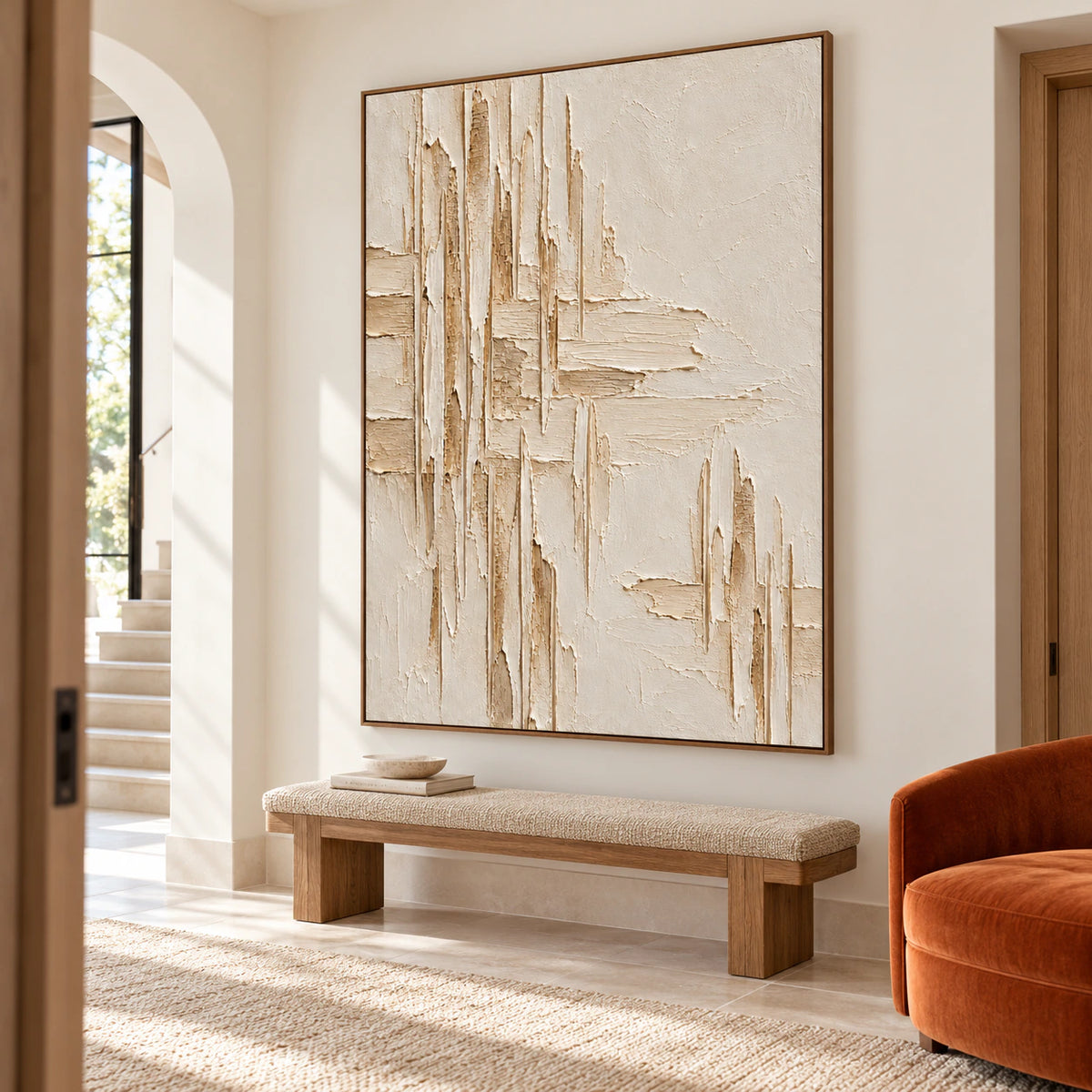 Large vertical ivory textured painting in a tall foyer with a stone floor, viewed from a slightly elevated left angle in bright daylight.