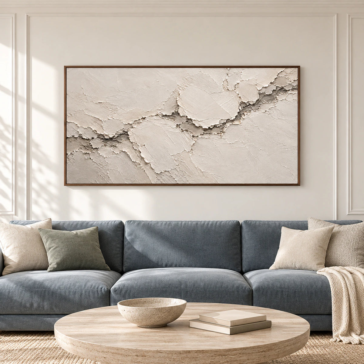 Large ivory and cream textured abstract artwork displayed straight-on in a spacious, light-filled room.