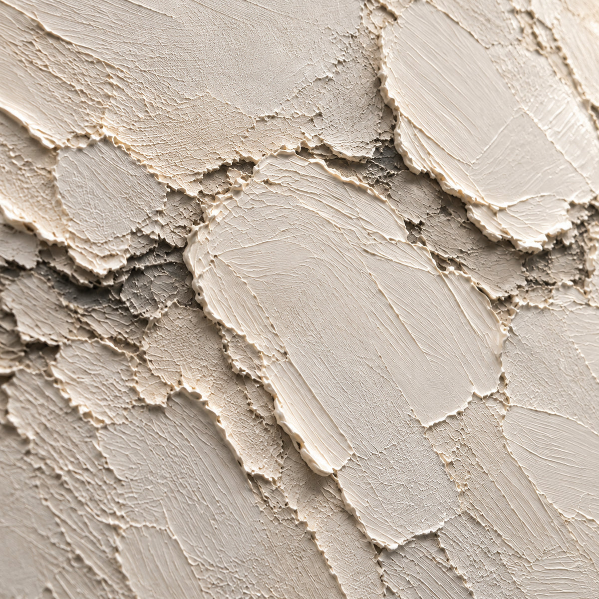 Ivory-Mantle oil painting brushwork and impasto detail photographed from an oblique side angle