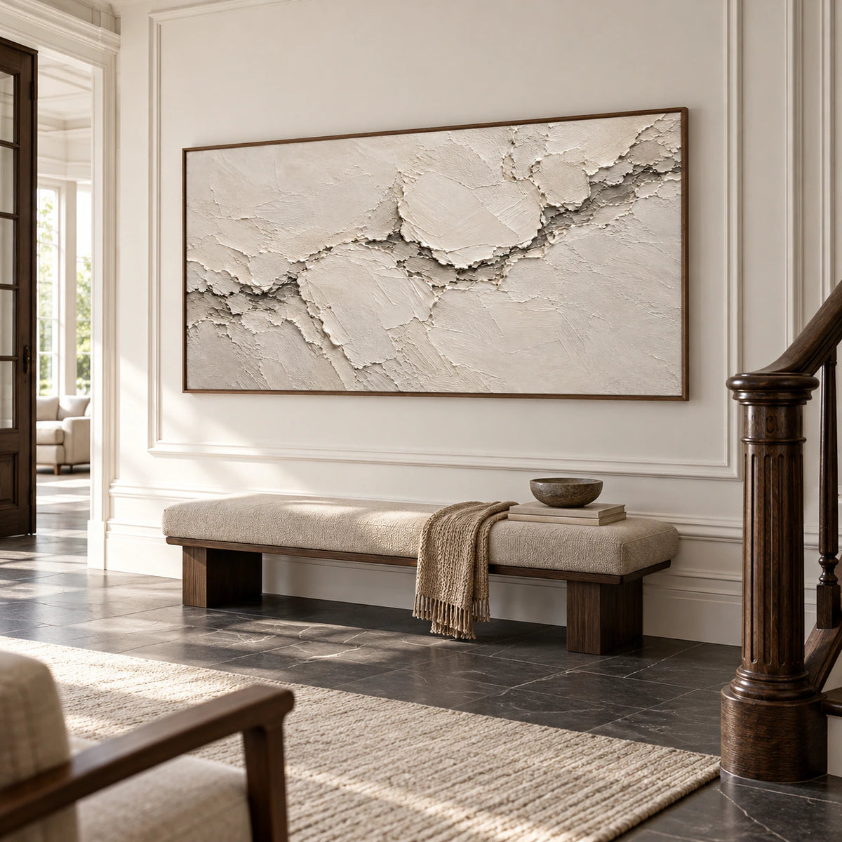 Large horizontal ivory artwork commanding a bright, gallery-scale foyer.