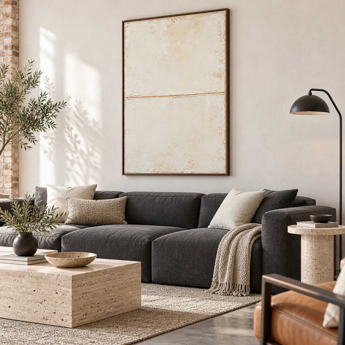 Quiet-Threshold above a sculptural sofa in a bright living room.