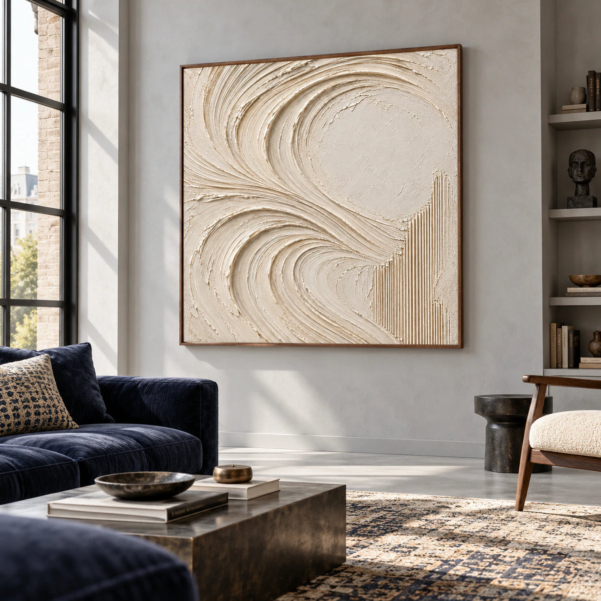 Large square ivory abstract painting on a cool gray wall, viewed from a low right angle across a spacious loft lounge with deep navy seating and pale concrete flooring.