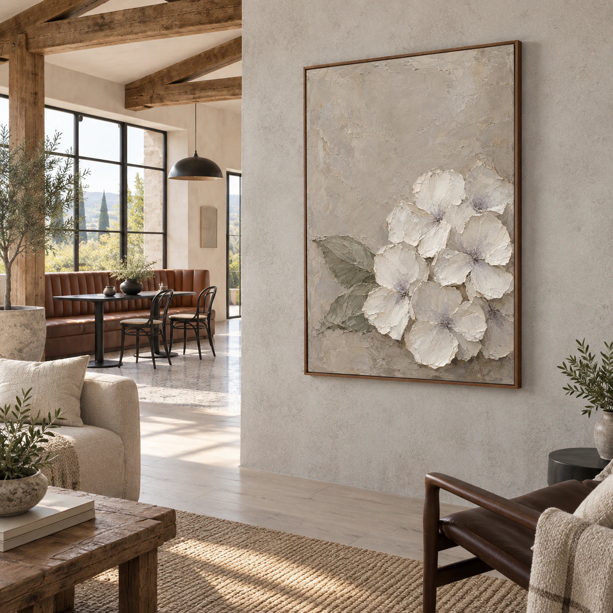 Open hospitality loft with the Ivory-Quiet painting as a prominent focal point.
