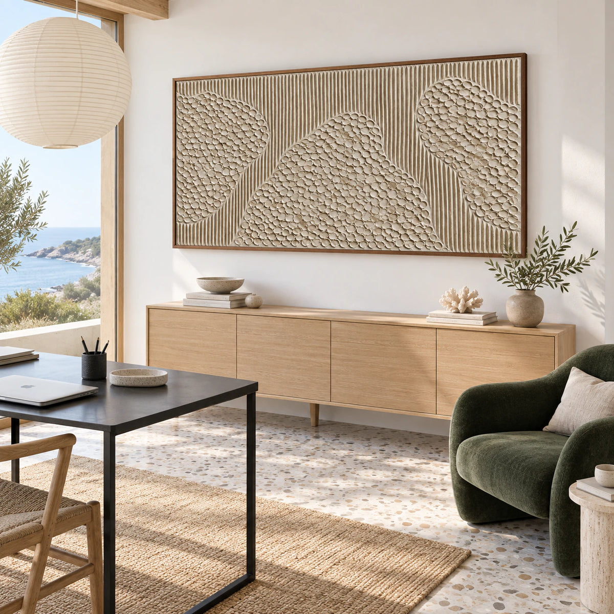 Ivory relief artwork in an airy home office with a timber desk and generous daylight.