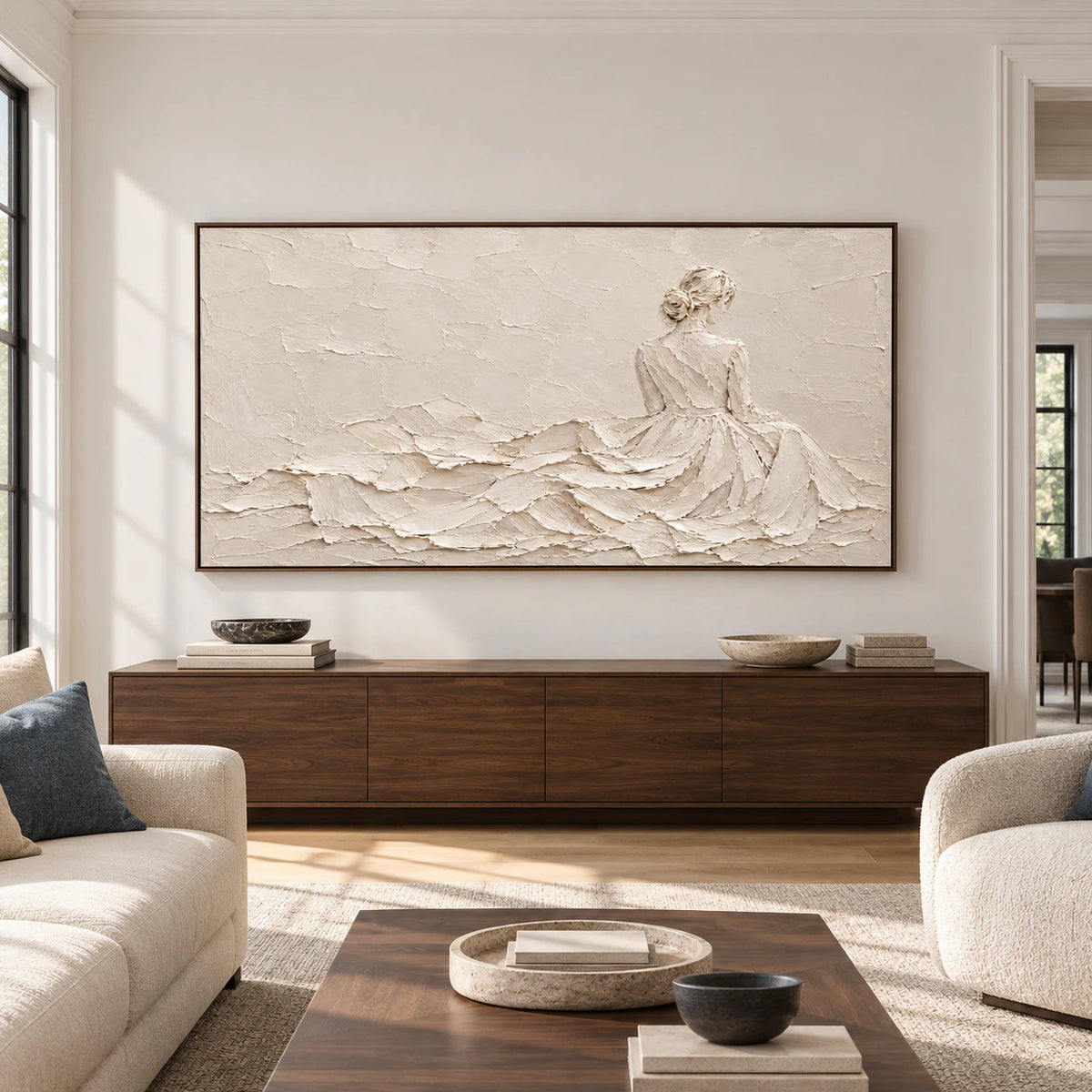 Straight-on view of Ivory-Reverie above a low, dark wood console in a bright, spacious living room with natural daylight.