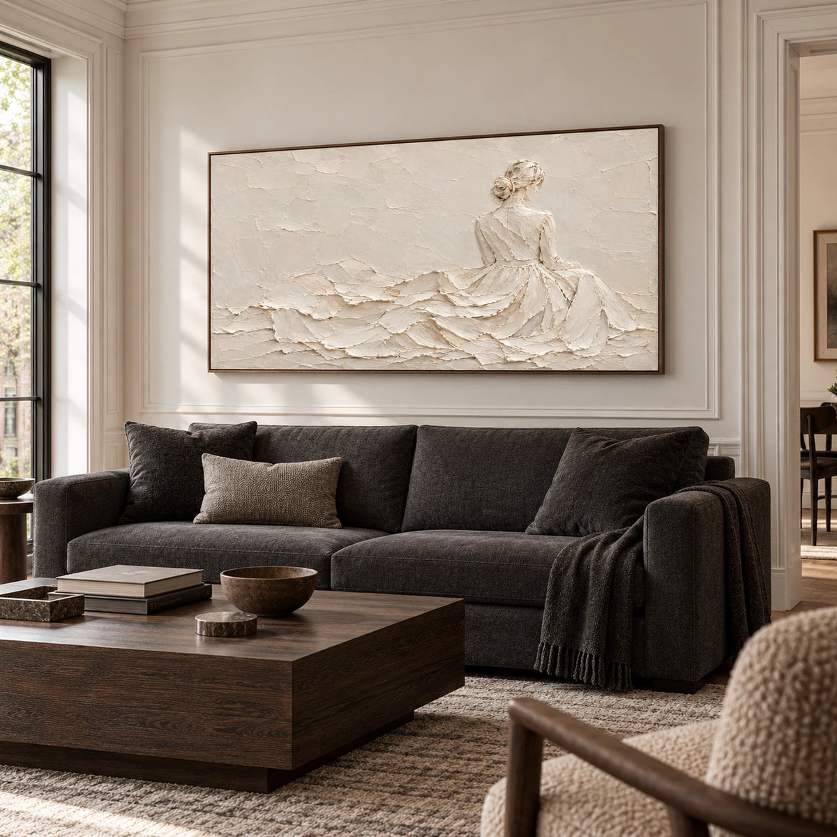 Ivory-Reverie above a charcoal sofa in a bright living room, viewed from a gentle left angle at seated eye height.