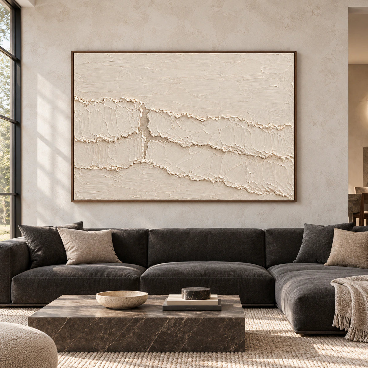 Large ivory textured abstract painting centered on a spacious living room wall, viewed straight on.