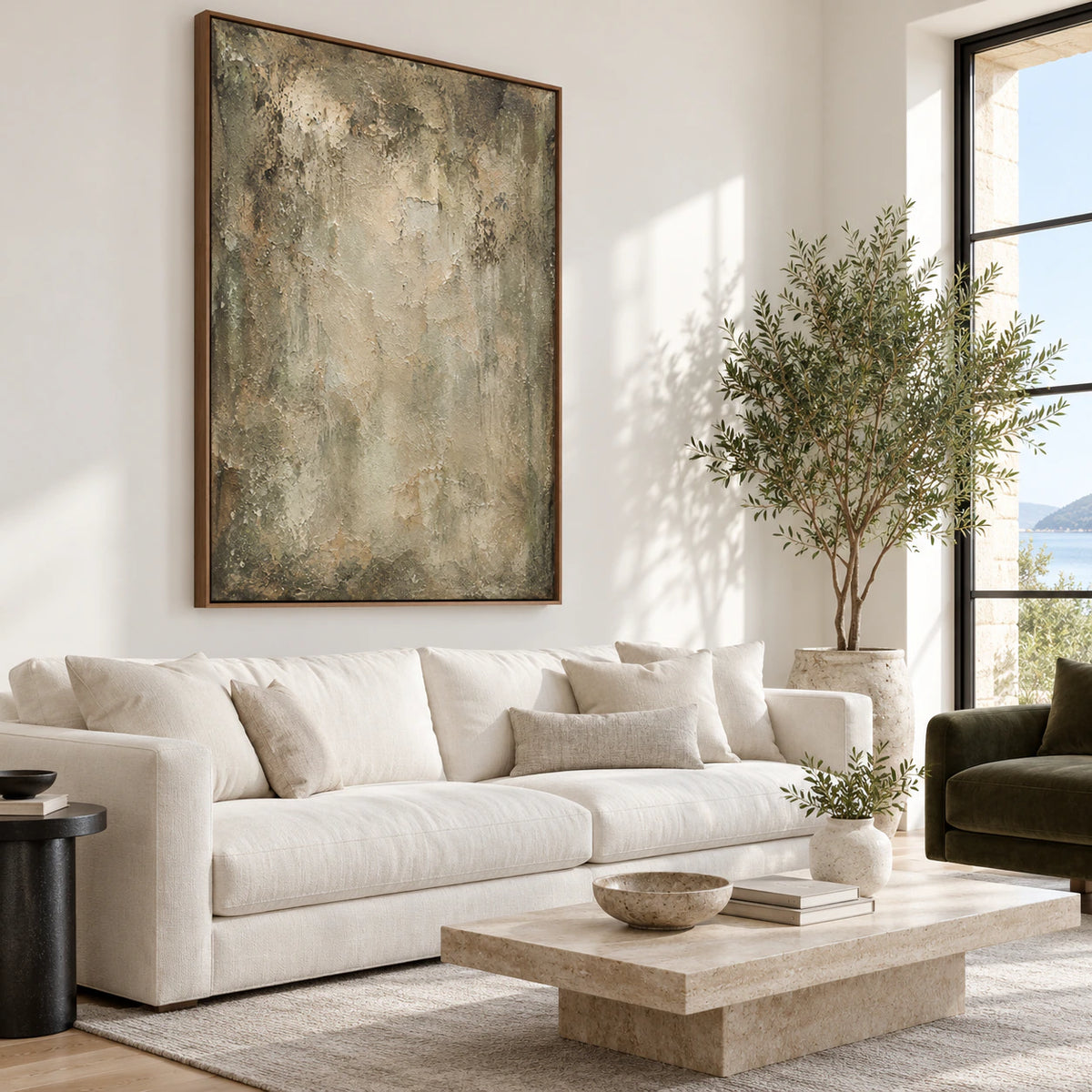 Textured vertical abstract painting above a bright living room seating arrangement.