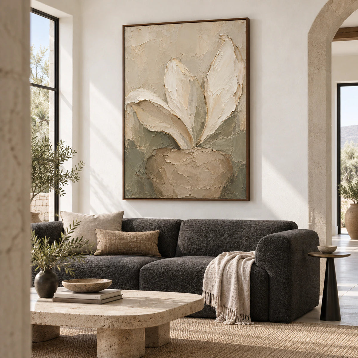 Linen-Anther above a restrained sofa in a bright contemporary living room.