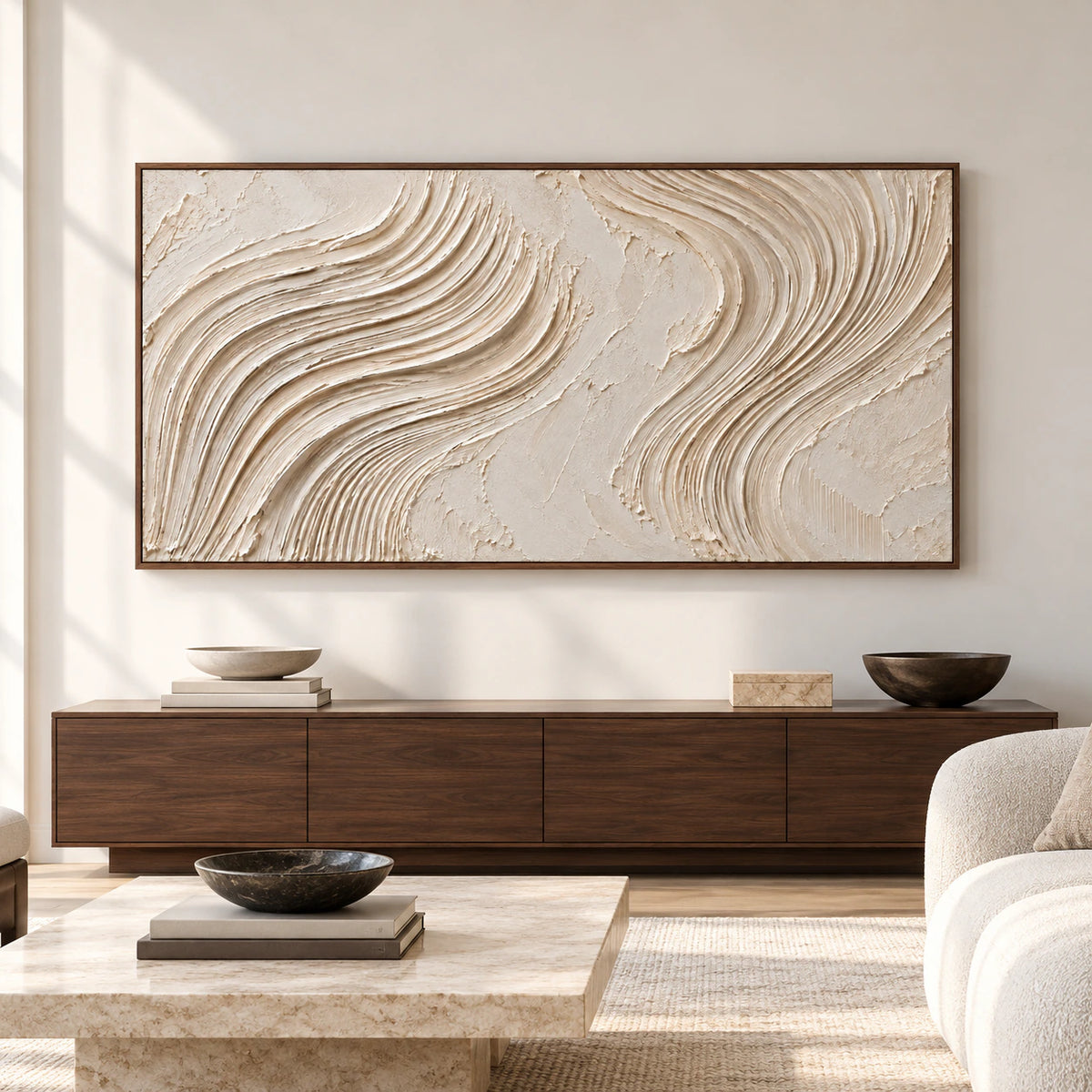 Large horizontal ivory textured abstract artwork with sweeping combed ridges displayed above a low console in a spacious modern living room.