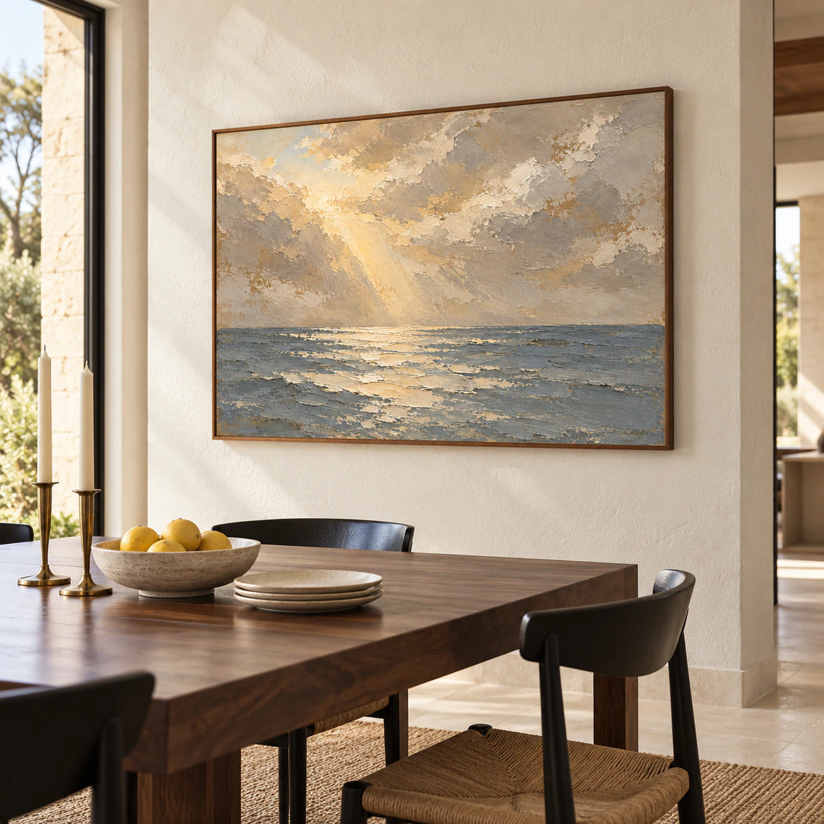 Seascape oil painting on a pale limestone wall, viewed from the right in a bright dining room with a dark walnut table, slim black chairs and tall windows.