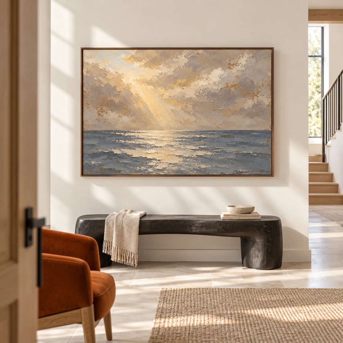 Large seascape oil painting on a tall warm-white foyer wall, viewed from the left at a low angle, with a pale stone floor, dark sculptural bench and high window.