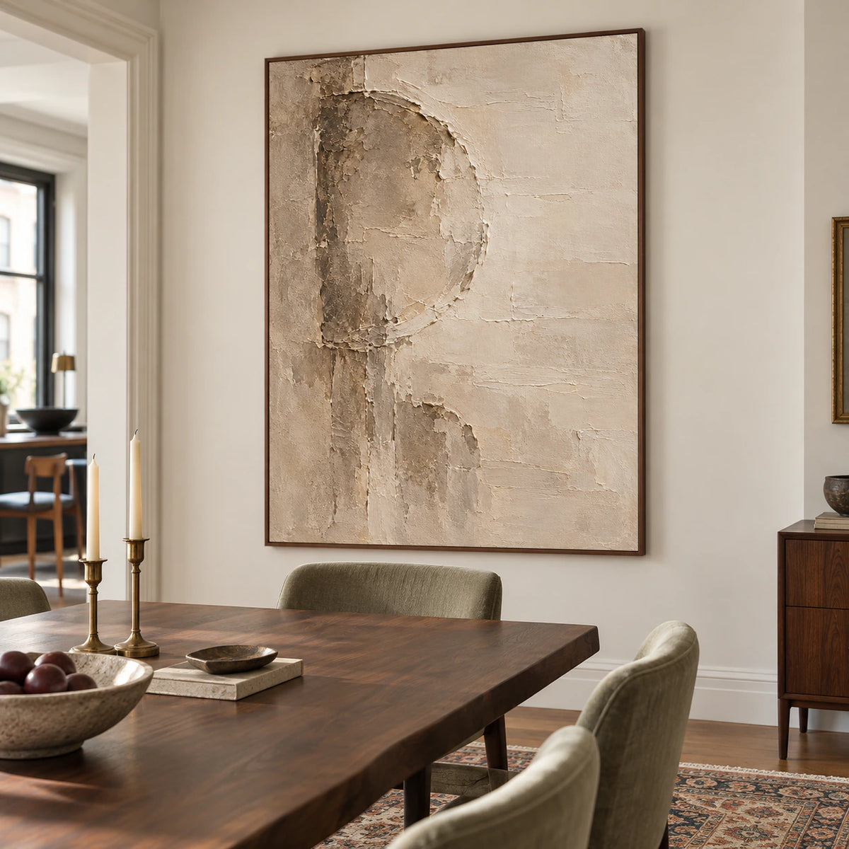 Marl-Aperture painting above a dark walnut dining table with pale stone or muted green chairs, viewed from the right at seated eye level.