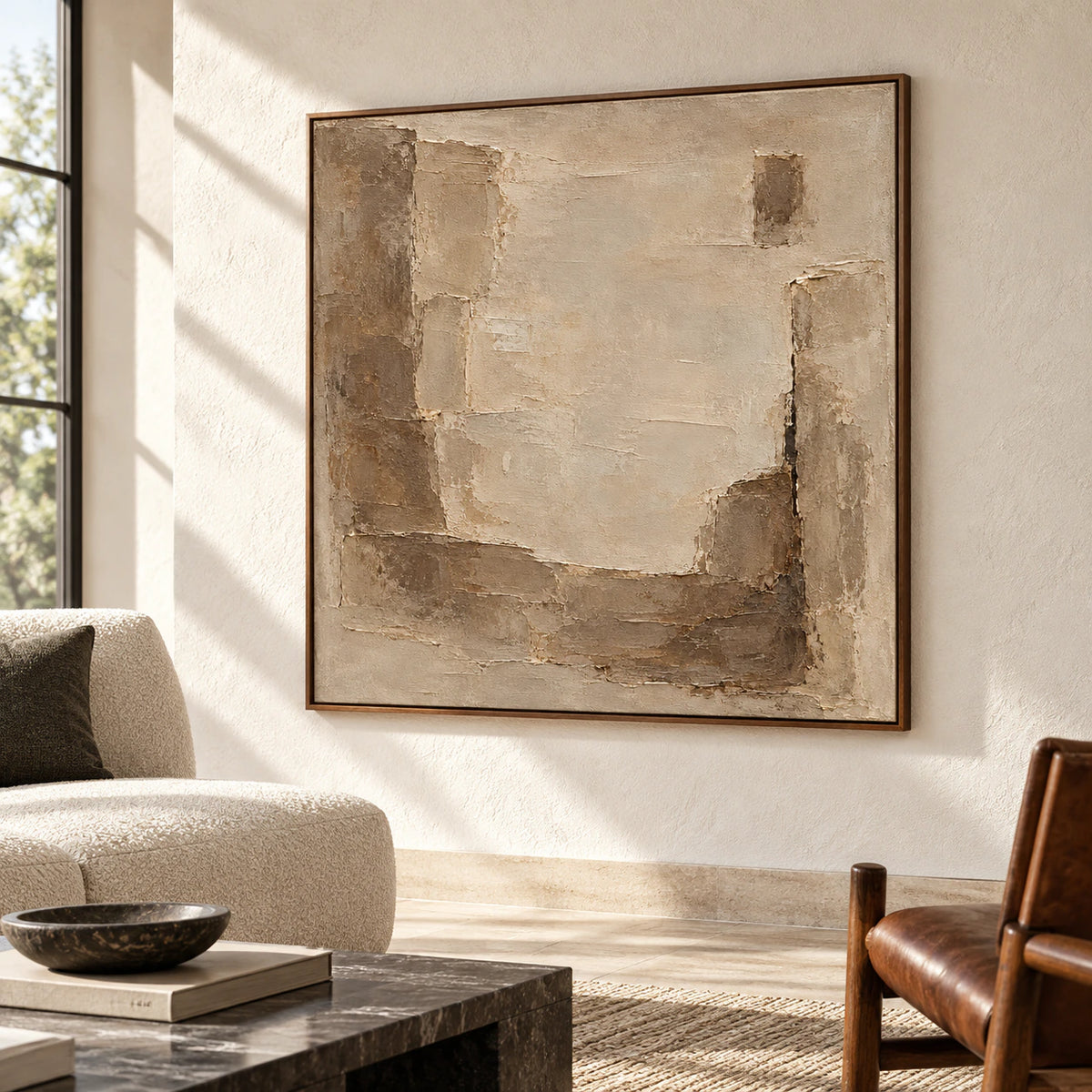 Large square abstract painting above a restrained sofa in a bright living room.