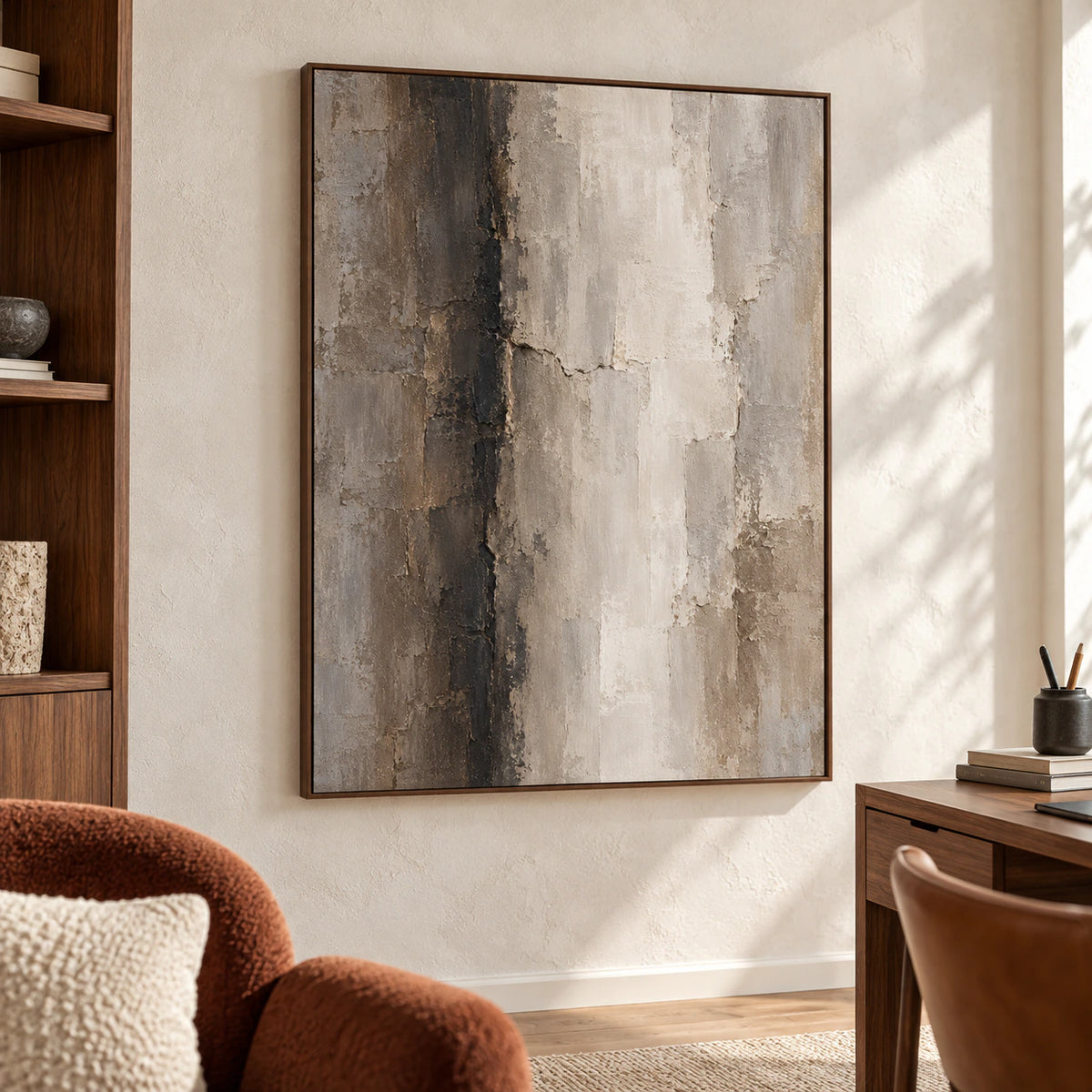 Large vertical abstract artwork in an airy home office beside a reading chair and desk, illuminated by natural light.