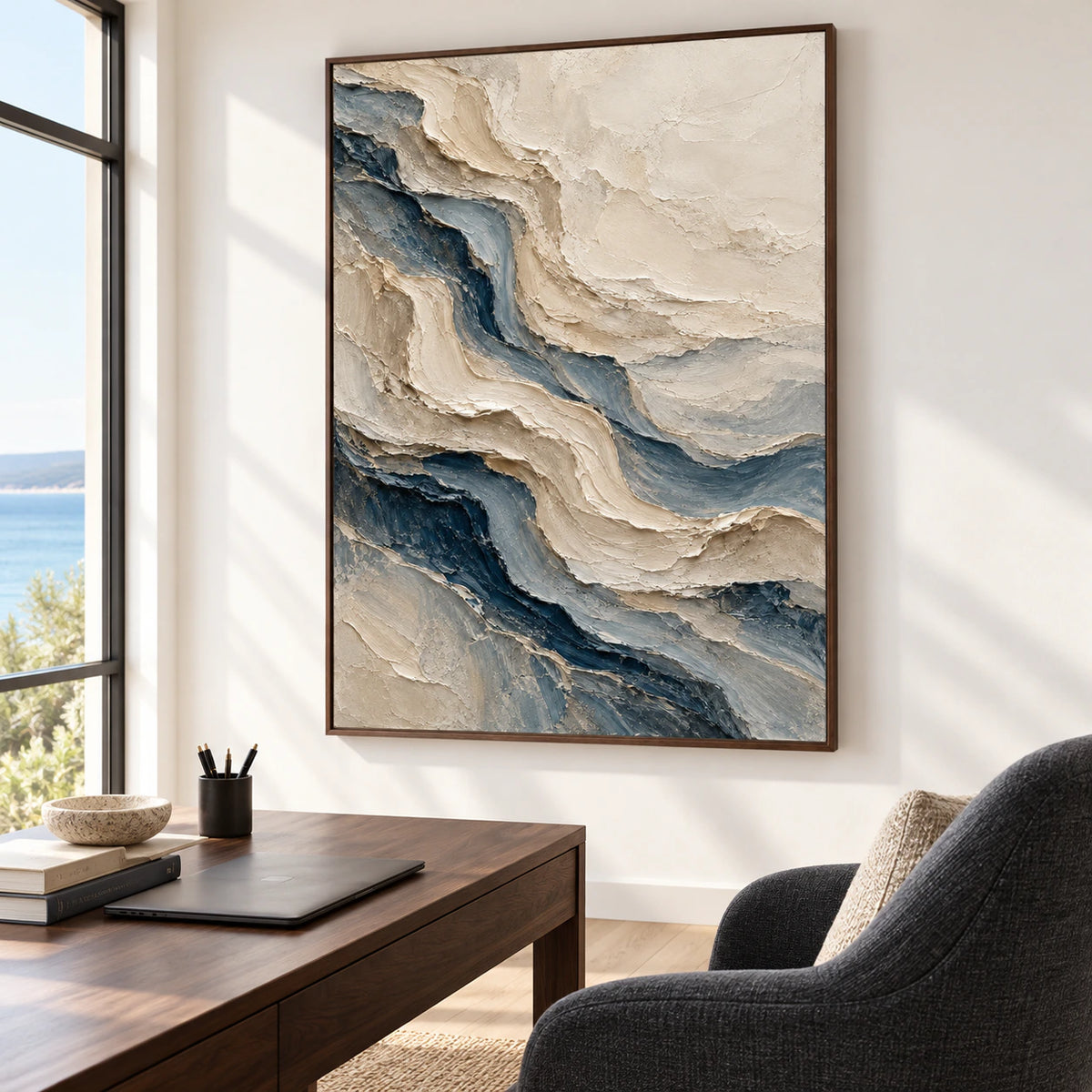 Large vertical ivory and blue-gray painting in a daylit office and reading space with a dark wood desk and charcoal chair, viewed obliquely from the right.