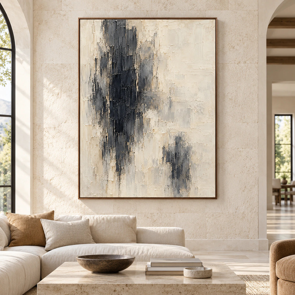Obsidian-Pillars displayed on a broad light stone wall in a spacious, bright living area, viewed straight-on with restrained furnishings.
