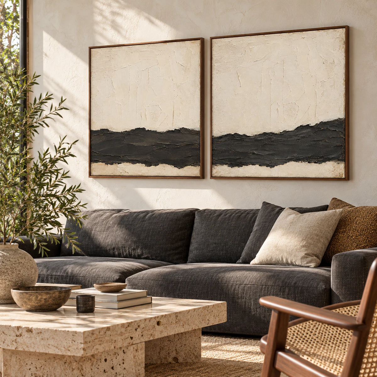 Bright living room featuring the two-panel Obsidian-Quiet diptych above a pale neutral sofa.
