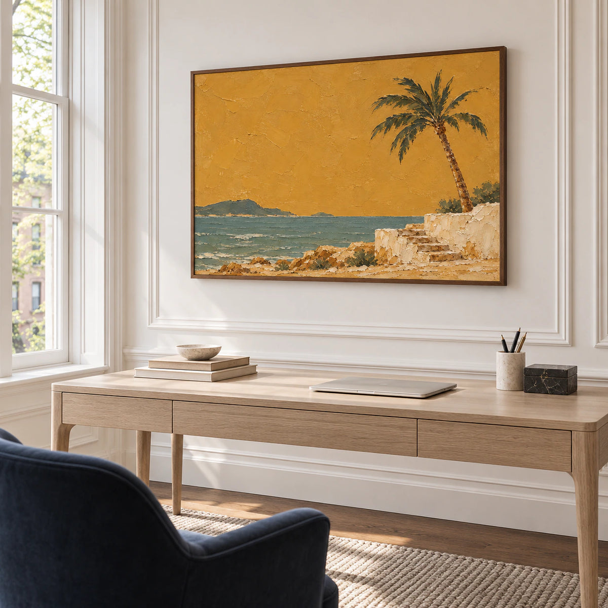 Large coastal painting anchoring an airy home office with a light desk and restrained furnishings.