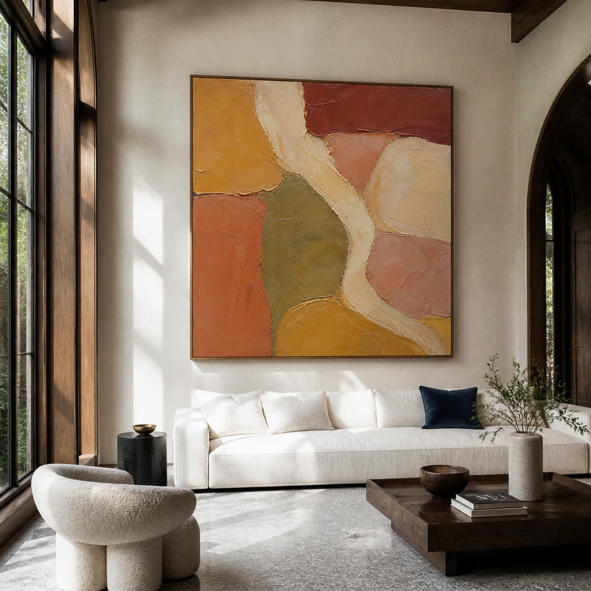 Ochre-Interlace as the focal artwork above a neutral sofa in a bright living room.