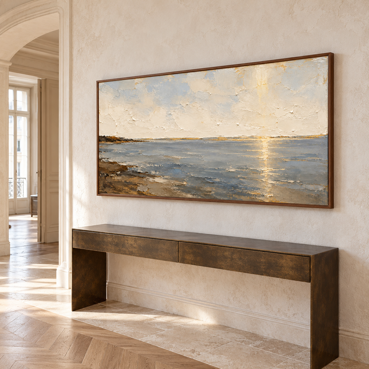 Ochre-Meridian seascape on a high, broad foyer wall with a pale stone floor and dark bronze console, viewed obliquely from the left near the entry.