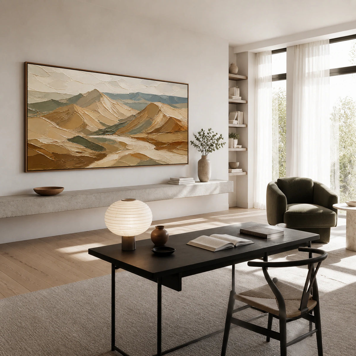 Textured abstract mountain artwork in an airy home office reading space.