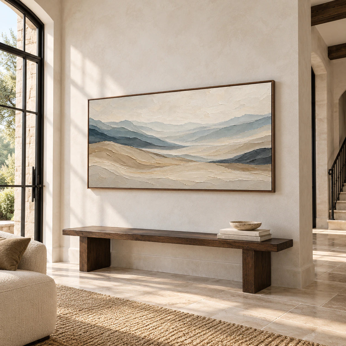 Ochre-Traverse above a long dark wood bench on a pale stone foyer wall, with a tall doorway and iron details, viewed from a low left angle in daylight.