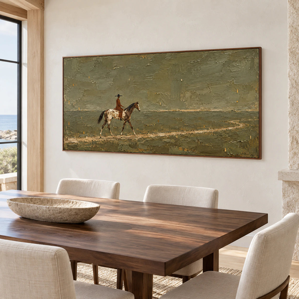 Ochre-Wayfarer on a warm white plaster wall above a dark walnut dining table with pale upholstered chairs, viewed from a right angle in daylight.