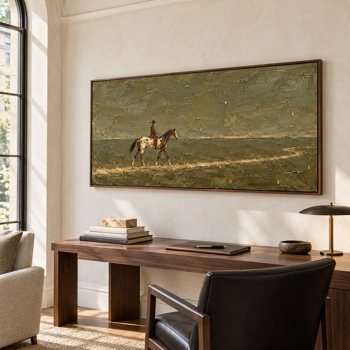 Ochre-Wayfarer above a slim desk in a daylit home office with light ash wood furnishings, off-white walls and a black reading chair, viewed from the right.