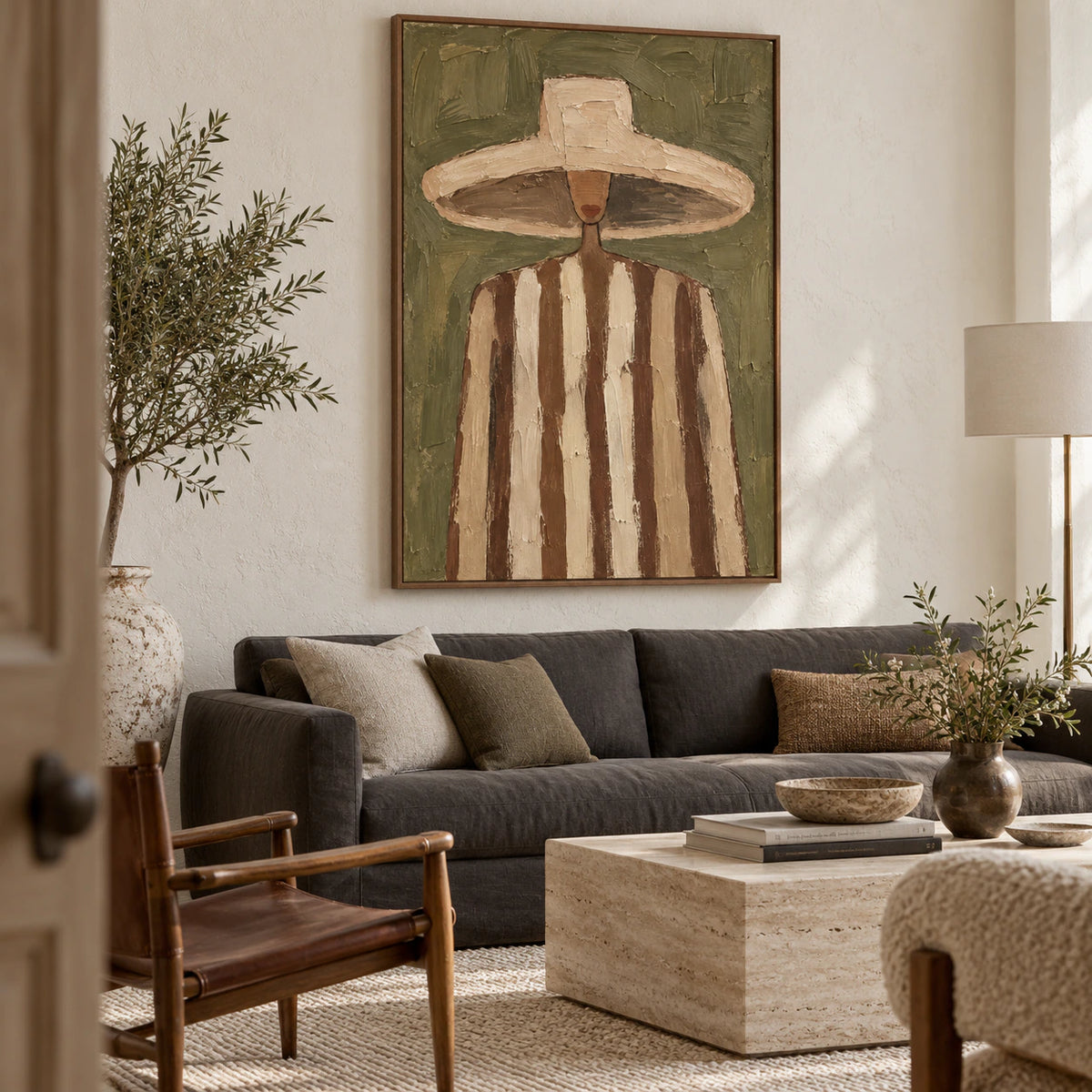 Olive-Emissary as the focal point in a bright living room with pale plaster walls and restrained contemporary furnishings.
