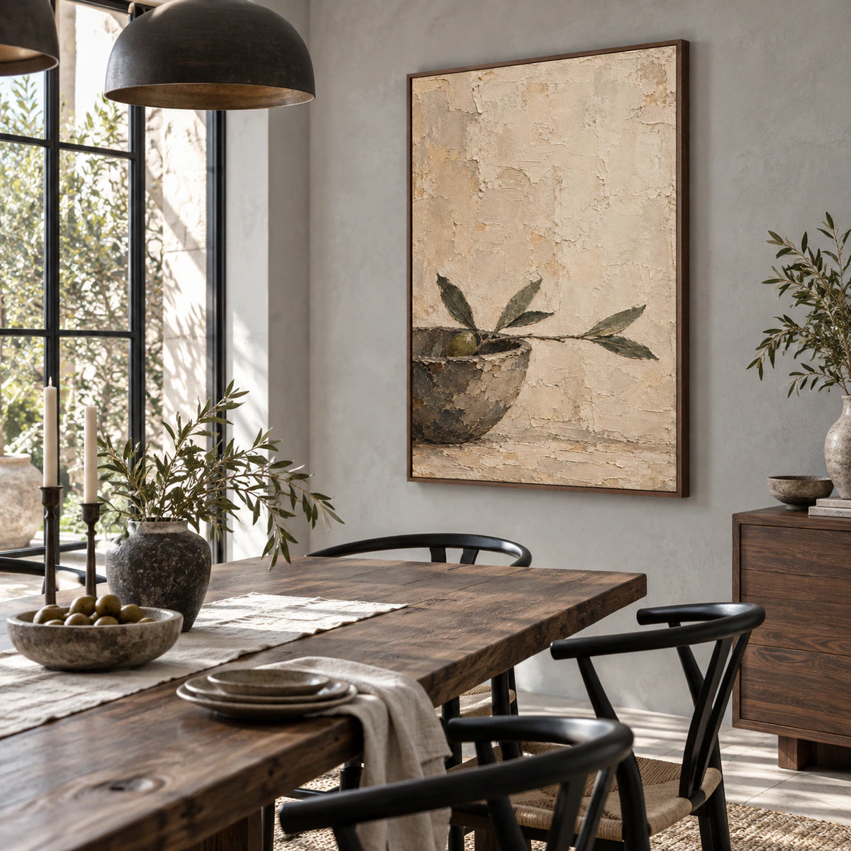 Olive branch textured wall art in a refined daylight dining room with a sculptural table.