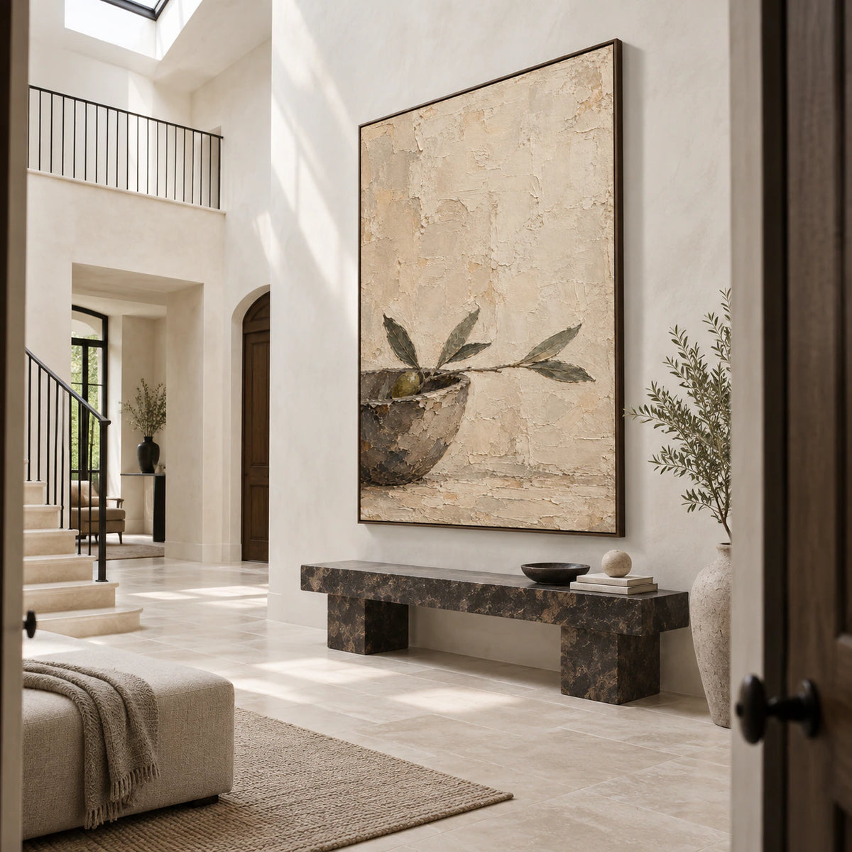 Large vertical olive branch painting in a bright gallery-scale foyer.